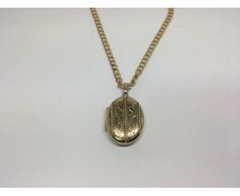 A 9ct gold oval locket with attached 9ct gold chain, approximately 20g