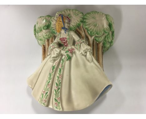 A Clarice Cliff wall pocket depicting a lady in a forest 868 18cm