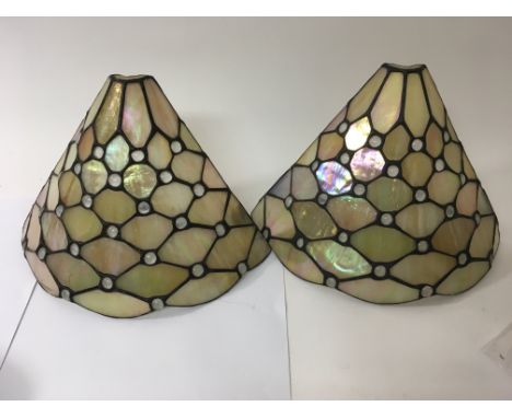 A Tiffany style ceiling light and two wall lights.