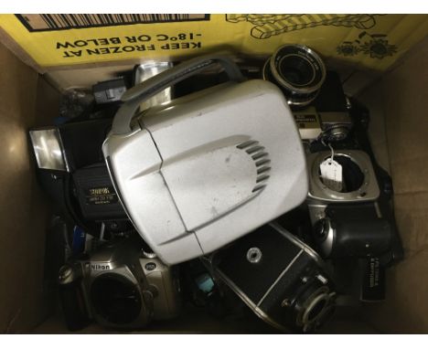 A box of camera equipment and bodies.