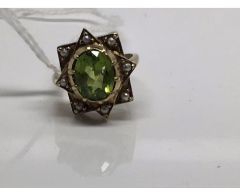 A Edwardian seed pearl and green tourmaline ring with 9 ct gold band 