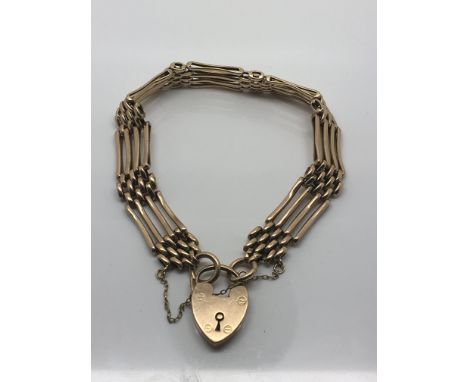 A 9ct Gold gate bracelet with a padlock clasp. 14g approximately.