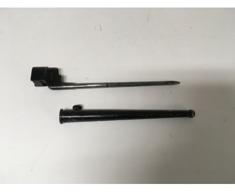 A British No.4 Mk. II "Spike" socket bayonet with a scabbard, marked with a serial number of "11687"