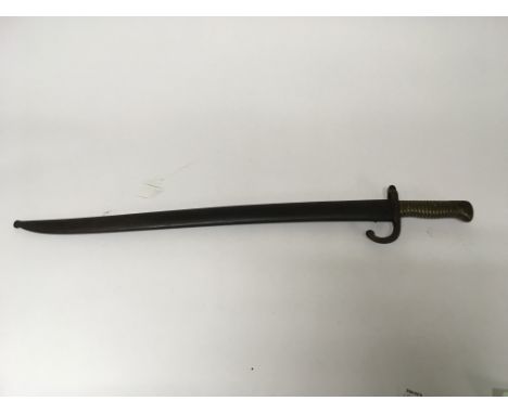 A French M1866 pattern bayonet for use with the 11mm Chassepot needle fire rifle. Embossed on the hilt and scabbard with "B65