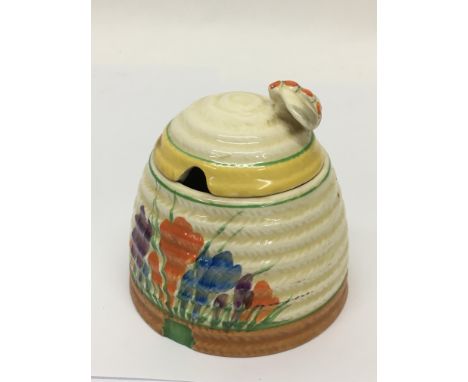 A Clarice Cliff beehive preserve pot in Crocus pattern, approx height 19.5cm.