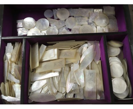A walnut box containing a large containing of mother of pearl Chinese gaming counters 