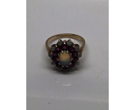 A 9ct gold opal and Ruby ring size M plus