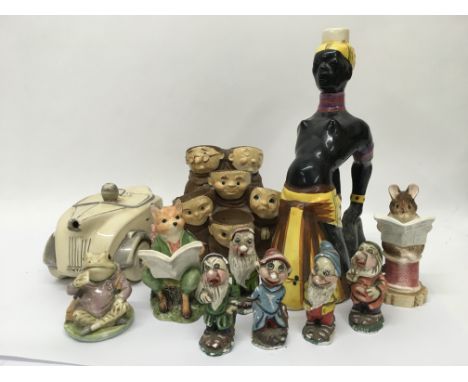 A collection of ceramics including some Beatrix Potter figures, Snow White pottery dwarves, ceramic car etc.
