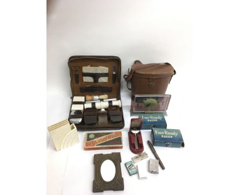 An Art Deco Fortnum and Mason mantle clock, gent's vanity case, binoculars and odds