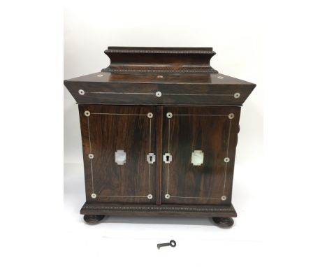 A fine quality rosewood writing cabinet with mother of pearl inlays and fitted interior, approx 33cm x 34cm x 23cm. Supplied 