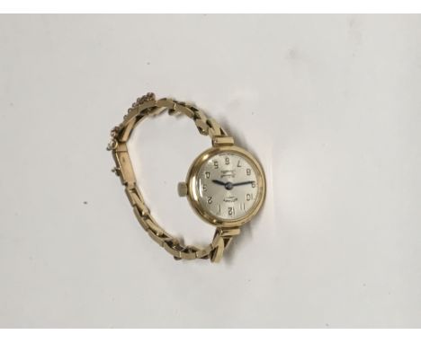 A 9 ct gold Rotary  ladies wrist watch with 9 ct gold strap 