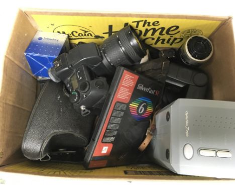 A box of camera equipment and bodies.