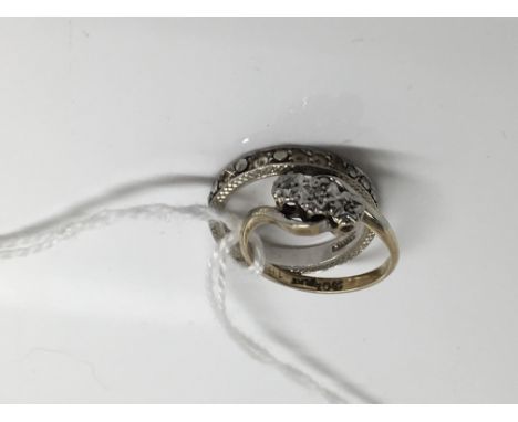  A three stone diamond ring and a silver eternity ring 