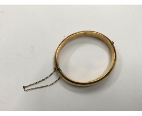 A 9ct gold bangle. Weight approx 13g