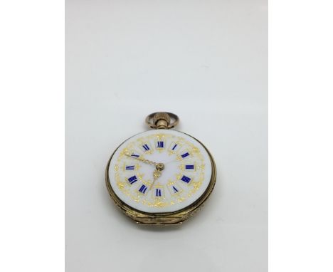 A lady's 18k gold button wind pocket watch with enamelled dial, lacking glass