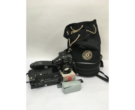 A Canon camera and photographic accessories.