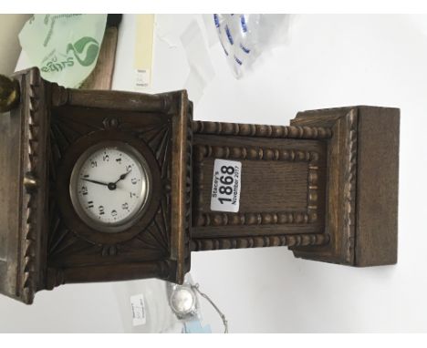 A small oak model of a longcase clock 
