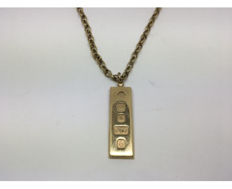 A 9ct ingot pendent with attached 9ct Gold belcher chain. Total 39g approximately.