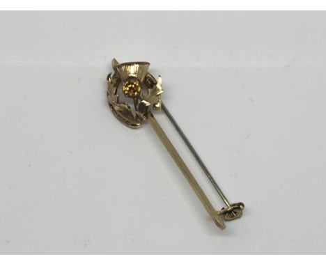A 9ct Gold stick pin in the form of a Scottish thistle, weight 2g approx.