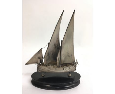 A Chinese silver model of a sailing junk.Approx 24cm