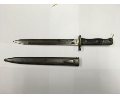 A Portuguese M1904 sword bayonet with some curious markings, includes a metal scabbard.