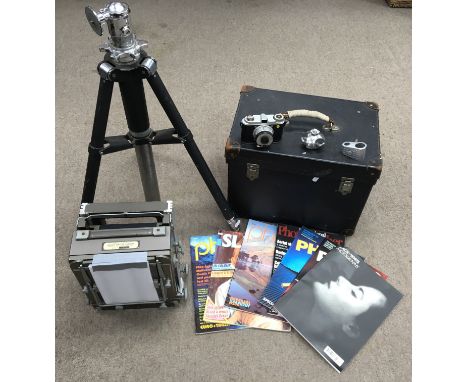 A vintage Kodak no.2 hole plate camera with original case, steel tripod, light meter and photographic magazines