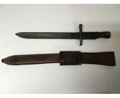 A US army WW1 Canada Ross Mk. 1 bayonet with leather scabbard. Faded makers marks.