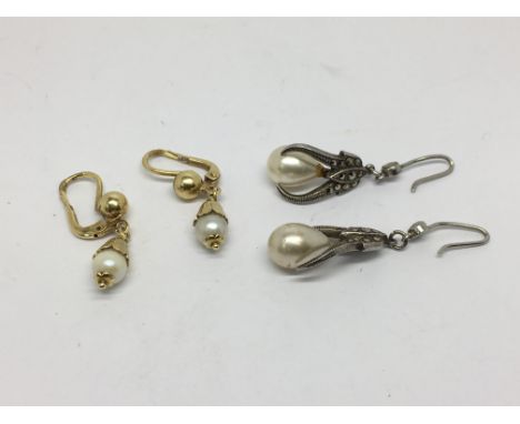 Two pairs of pearl drop earrings.