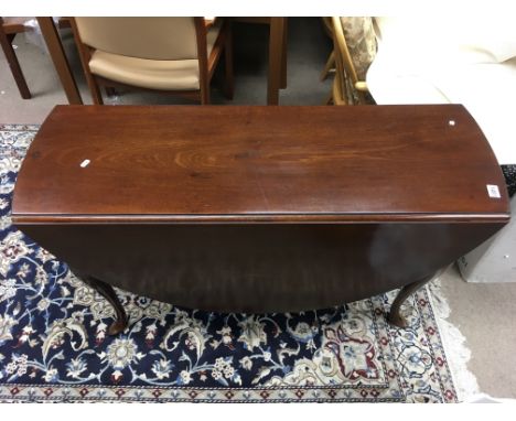 A Mahogany gate leg drop leaf dining table with cover, possibly George the 1st or 2nd era.