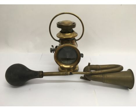 A vintage car horn and a car lamp (2).