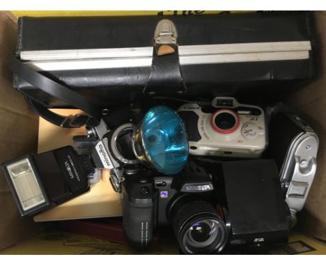 A box of camera equipment and bodies.