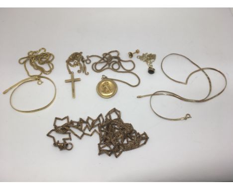 A small group of mainly 9ct gold jewellery odds including a cross, St.Christopher pendant and watch chain.Approx 42g
