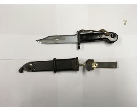 A post War East Germany AKM Type I bayonet with the original metal scabbard.
