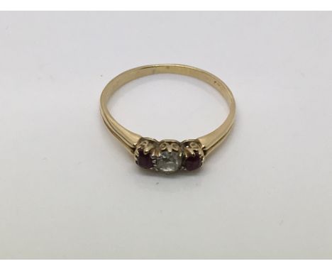 A gold, diamond and ruby ring, approx size O and approx 1.9g.