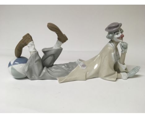 A Lladro figure of a clown laying on his tummy playing with a ball (35cm Approx)