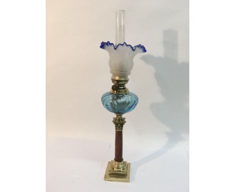 An oil lamp with blue and clear glass shade plus a blue glass reservoir, approx 54.5cm.