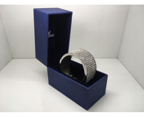 A Swarovski bangle in original box.