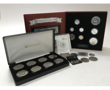 A 90 glorious years commemorative coin and stamp set, set number 031 of 499, two silver 90th birthday coins, a jubilee mint s