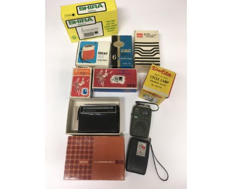 An interesting collection of 1960 s boxed  / unboxed transistor radios and a boxed cycle lamp