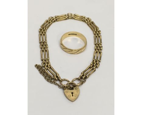 A 9ct gold gate bracelet with a padlock clasp and an 18ct gold ring, approx size P-Q. Approx weight 13g.