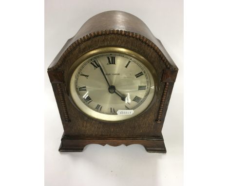 Two oak mantle clocks one by Bulle-clock the other by Empire