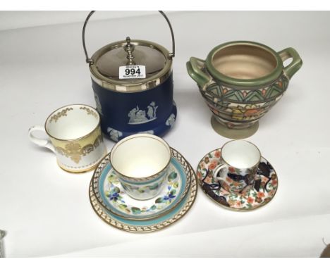 A Charlotte Rheed Art Deco design pot, a Wedgewood biscuit barrel and decorative cups and saucers. 