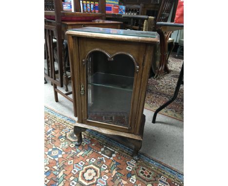 A small display cabinet with glass shelf.