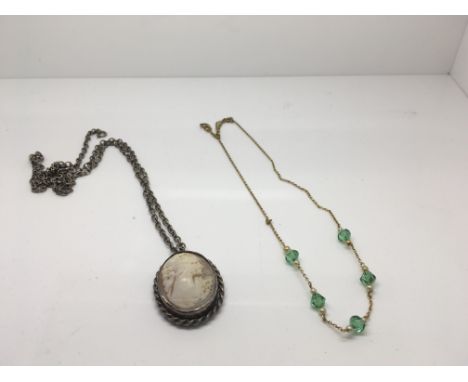 A 9ct gold and green stone necklace and a silver cameo pendant on chain