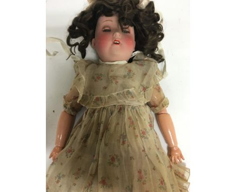 A  German bisque headed doll with jointed limbs impressed marks to the head H W  57 cm approx 