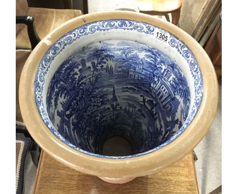 A 19th century decorative ceramic toilet, with blue and white printed interior.Approximately 40cm high