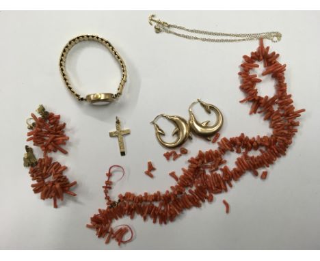A 9ct gold cross pendant (weight approx 3g), a coral necklace (in need of restringing) with matching earrings, an anchor pend