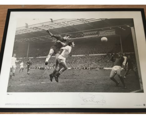 A framed and signed black and white print of Peter Osgood of Chelsea playing against Leeds United in the 1970 FA Cup final at