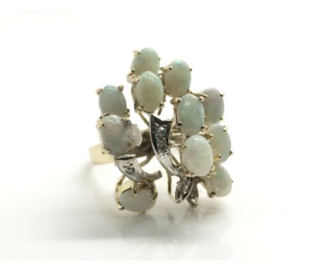 An interesting ladies 9ct yellow gold opal and diamond cocktail cluster ring, ring size approximately M, total weight approxi