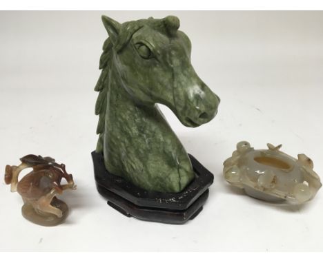 A carved jade type horse head on wooden stand, a carved jade type brush pot and similar bird.Horse approx 17cm high minus sta